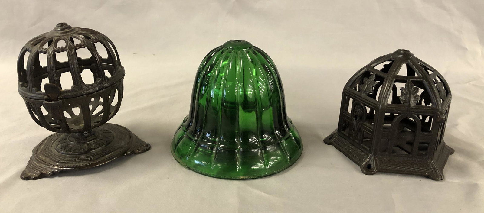 Lot of Three Early String Holders.: Two Cast Iron and One Glass Bell Shape in Green Glass. Tallest is 5 1/2"