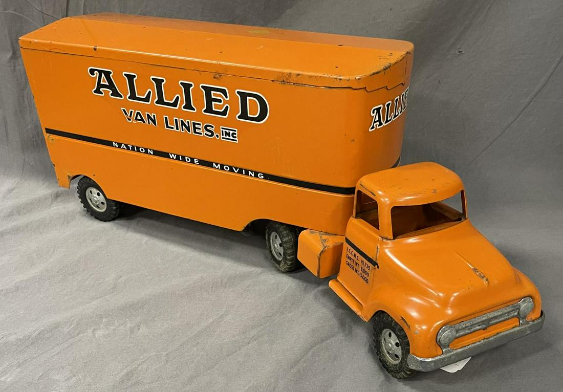 Scarce 1955 Tonka Allied Van Lives: 1st fendered cab. It is clean with clear, better than average decals. It has a 1/4 size stain on trailer roof, otherwise shows light to moderate playwear.