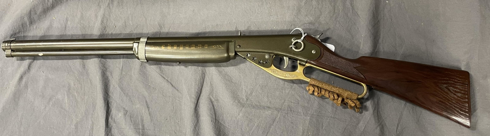 Daisy Cheyenne Pop Gun Rifle with Ricochet: Steel body with plastic stock, 34"Â long. Cocked and popped with ricochet sound when fired(Loud). It shows light playwear.