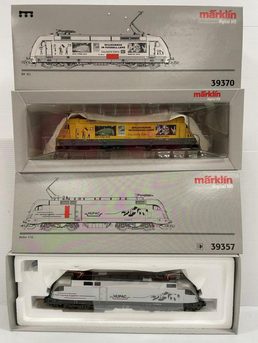 Marklin HO 39357 & 39370 Digital Electrics: Includes a 39370 BR101 2006 Soccer; 39357 Swiss Rh 1116 HUPAC electric. They are new in boxes.
