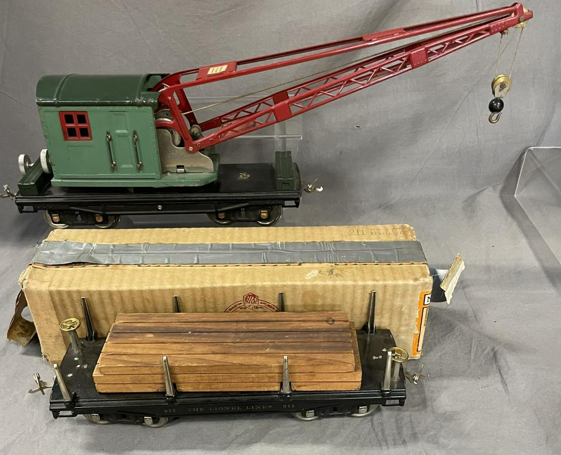 Clean Lionel 211 & 219 Freight Cars: Standard gauge. Includes a nice 211 Lumber car with taped box; 219 Crane, functional, but elevator gear is fatiguing and has lost 2 teeth(So Far), but has very nice paint. From The Estate Collection O