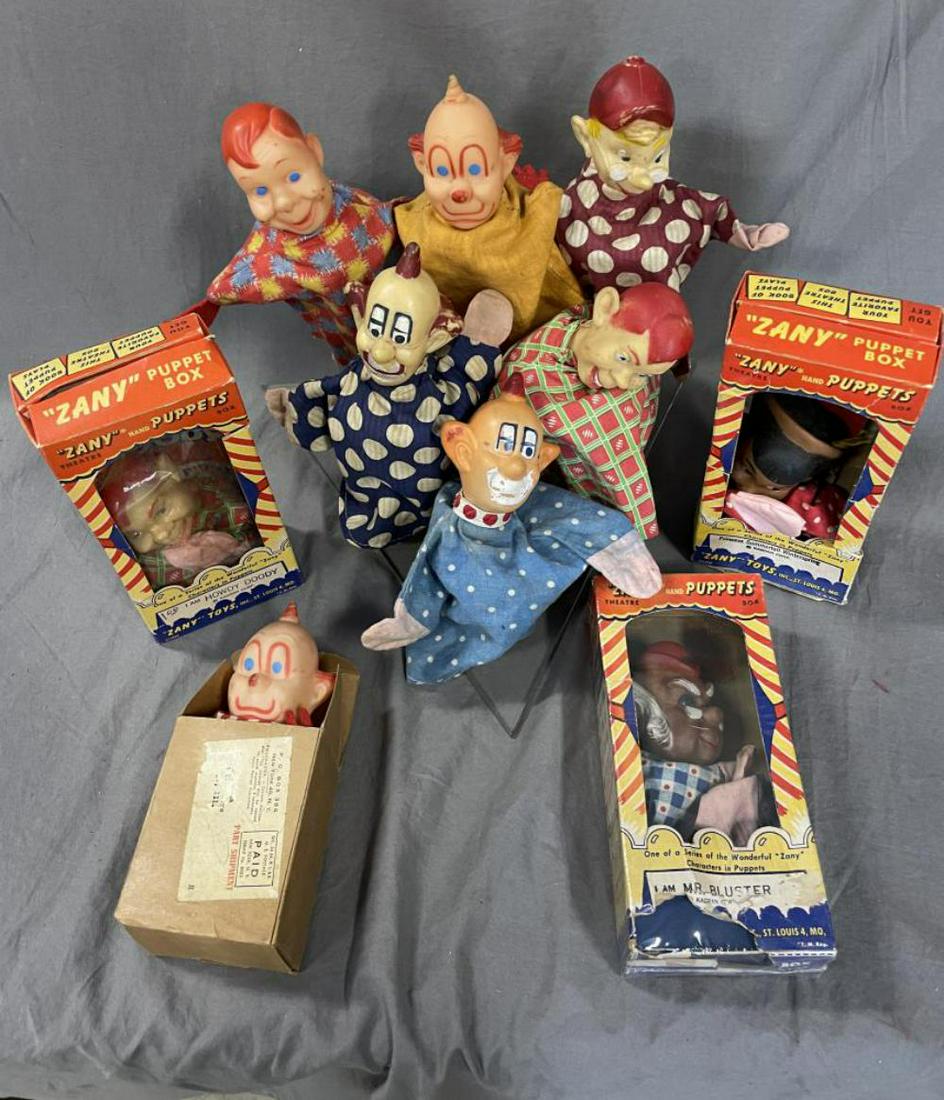 10 Assorted Howdy Doody Hand Puppets: Includes a boxed Clarabell in Promo Mailer; 3 Zany Puppets in 4-color boxes, 2 showing some wear, plus a 6pc group on plexi display stand, some showing wear. All different variations. Examine.