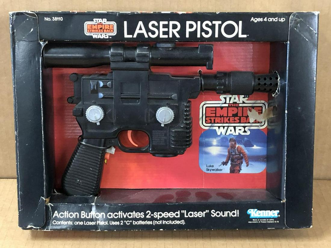 1980 Star Wars Luke Skywalker Laser Pistol, Boxed: Star Wars Empire Strikes Back Luke Skywalker "Laser Pistol" in Original Box by Kenner, 1980. Pistol is tied to the cardboard insert. Tested and did not work at the time of cataloging. Box shows edge a