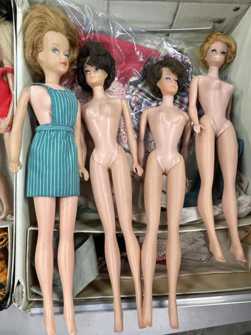 1961 Barbie Case with Dolls: Includes four 1960s Barbies, 1 marked Midge; 2 small Skippers; Ideal Tammy with Grow Her hair, pus several Mostly Barbie Outfits. All in a patent Leather style case, missing drawers.