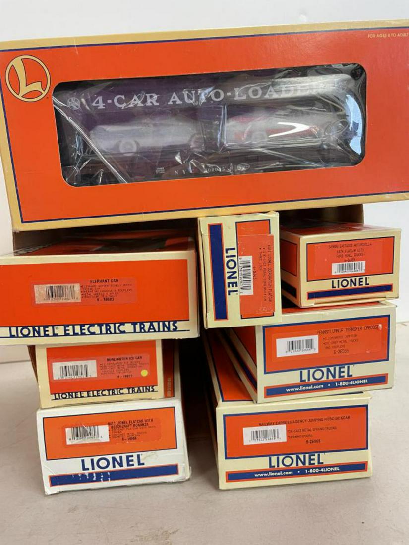 8 Lionel Freight Cars: Includes 26869 Jumping Hobo; 16969; 19823; 19489 Auto-Loader; 36555; 16683; 1698516963. Most appear like new with boxes.