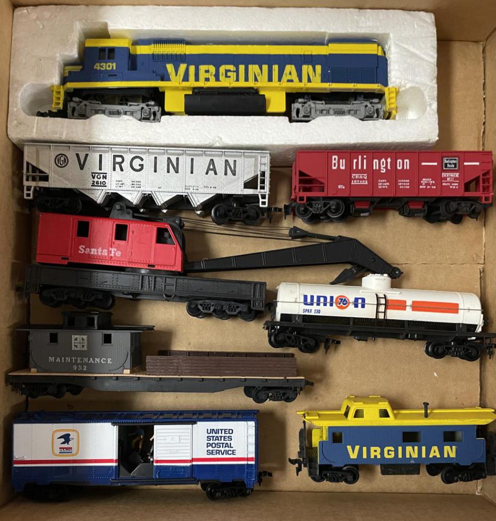 Tyco Virginian Diesel Freight Set: Includes a Virginian EMD Diesel, 6 freights including an operating mail car, plus the matching caboose. All show light play wear with loco foam insert only.
