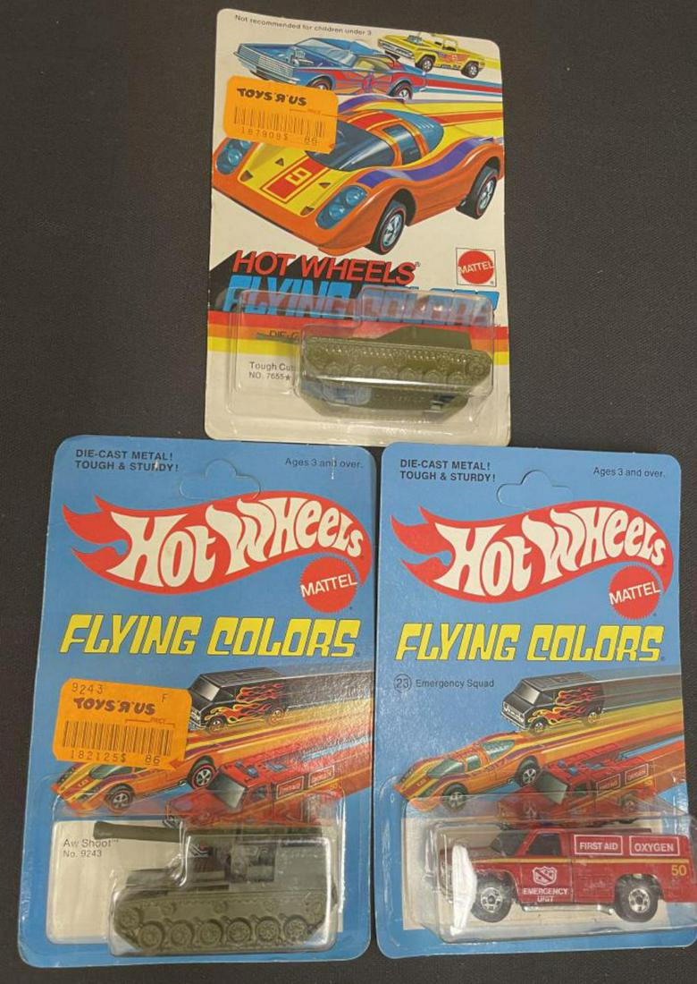 (3) Mint Hotwheels Redline Period Vehicles: Nice 1975 Mattel Flying colors 9243 AW SHOOT Mobile Gun 1973 #7655 Tough Customer Tank; 23 Emergency Squad(black wheel). All sealed on nice unpunched cards, 2 with price tags.