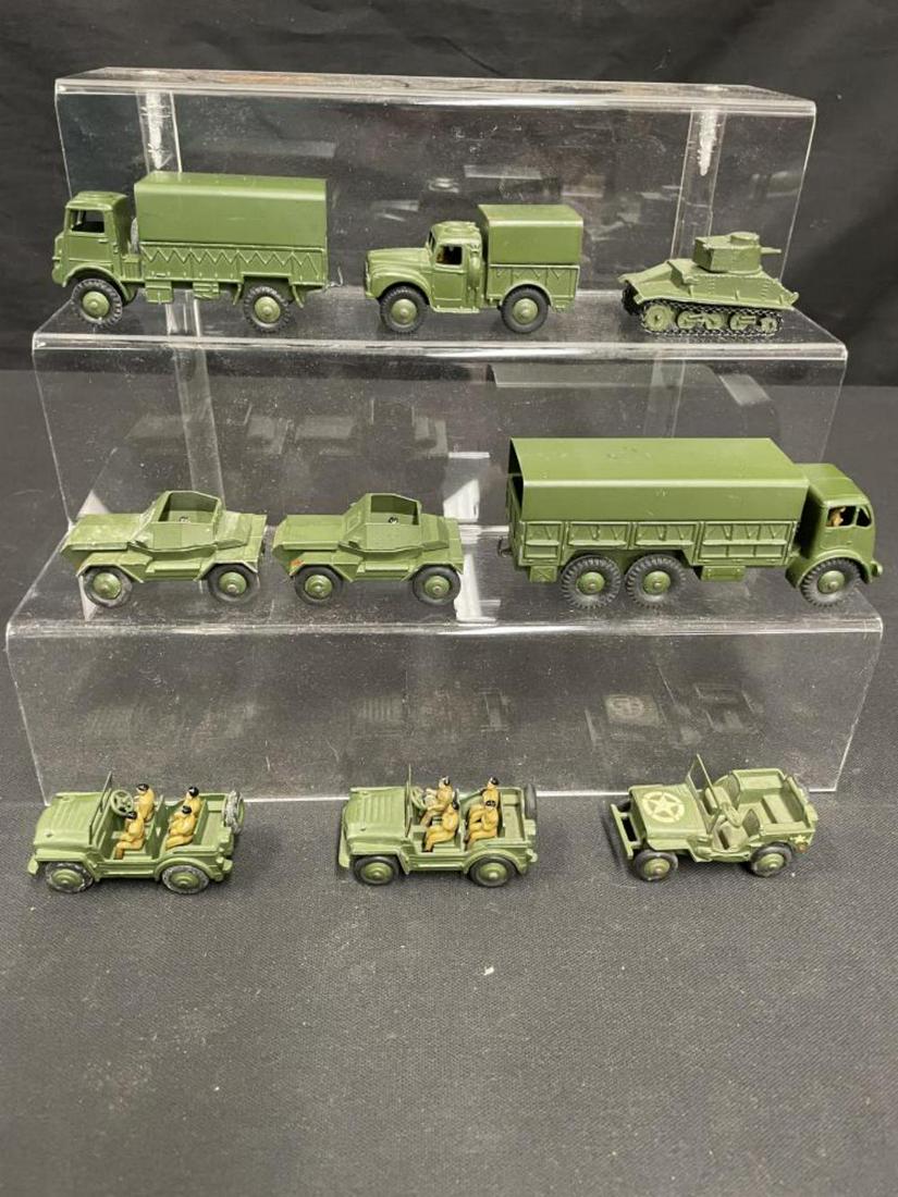 9pc Dinky Military Vehicles: Includes a 153A; 622; 2 #673, each with 4 soldiers; 2 #674; 623; 641 & 151A. All show light play wear and are clean.