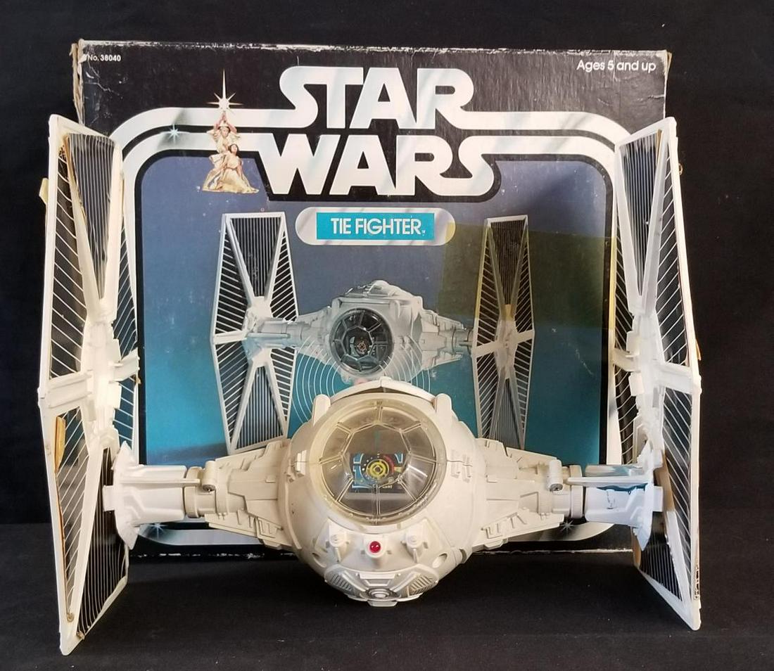 1977 Star Wars Tie Fighter in Original Box: Vintage, copyright 1977 by Kenner. Loose, complete in opened box. No instructions or cardboard inserts present. Decals have been applied, and many show some wear and are peeling. Toy shows playwear. N