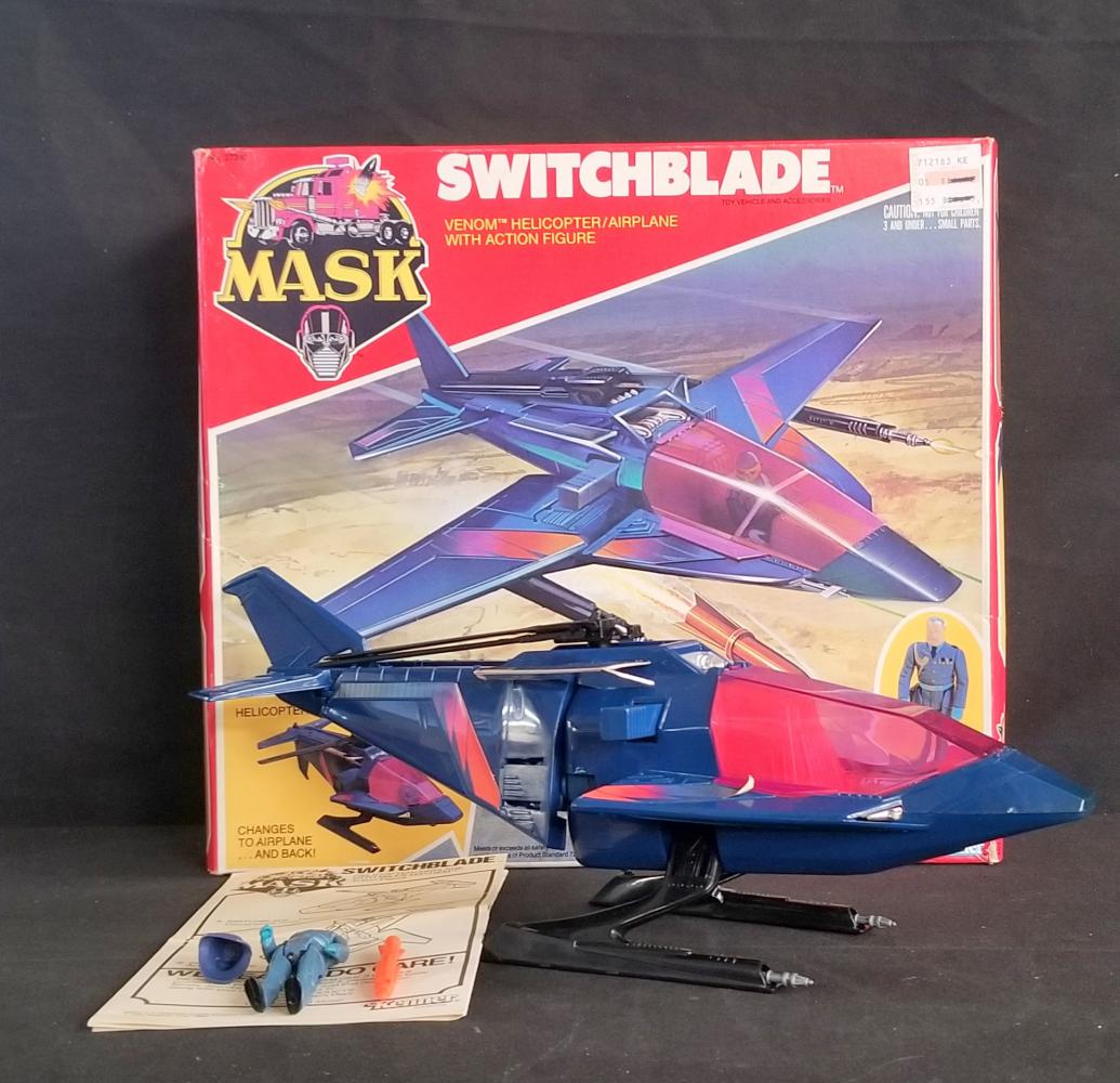 1986 MASK Switchblade Complete in Opened Box: Vintage, 1986 by Kenner. M.A.S.K. (MASK) "Switchblade" Venom Helicopter/Airplane Vehicle. Opened box, complete with Miles Mayhem action figure, Viper Mask, bomb, and instructions. Decals have been app