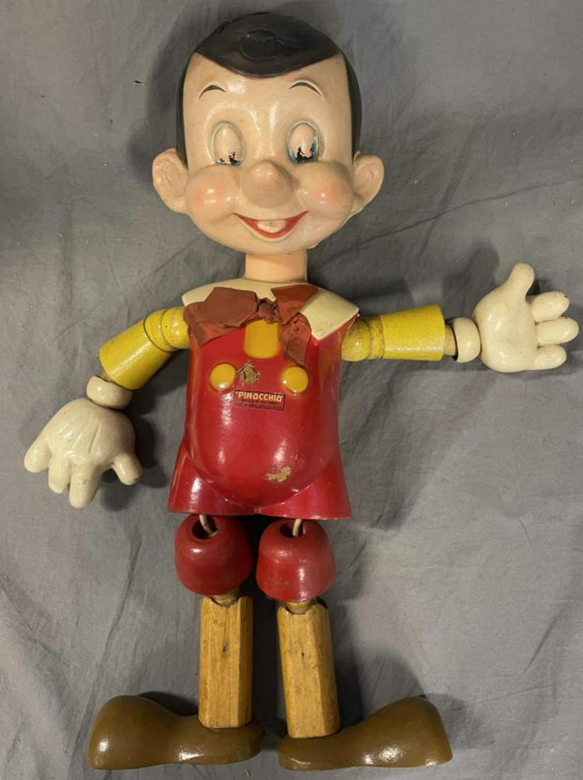 Scarce Large Ideal Jointed Pinocchio Doll: Painted composition, 20: tall. Largest size for this piece, often used as a store display. It needs stringing, but only has a few small damage spots, missing hat, and over-all shows light to moderate 