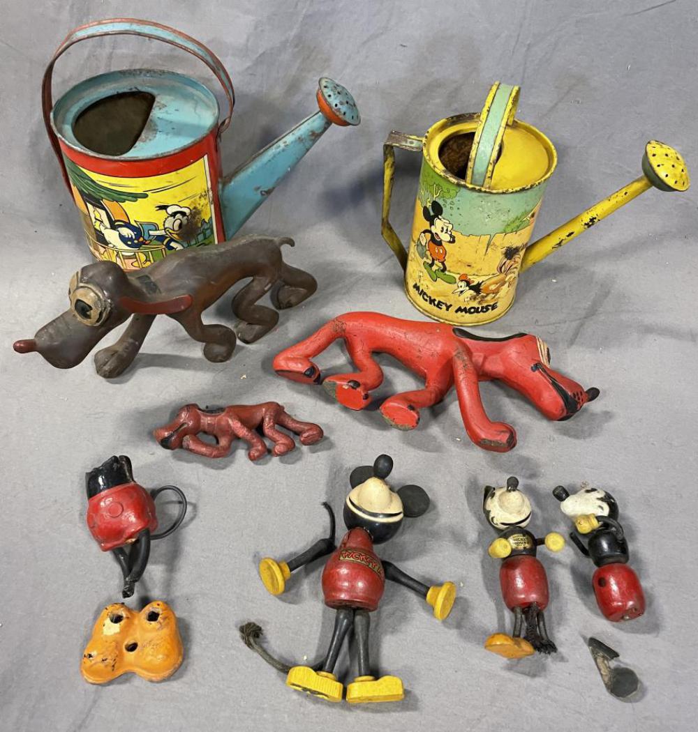 Assorted Vintage Disney Toys: Includes two large and a small Sterling Hard Rubber Plutos; Parts to Lionel 1100 Mickey Mouse figure; 3 Partial wood Mickey Mouse Toys; Early Ohio Art Disney Watering Can in poor condition; 1938 Ohio