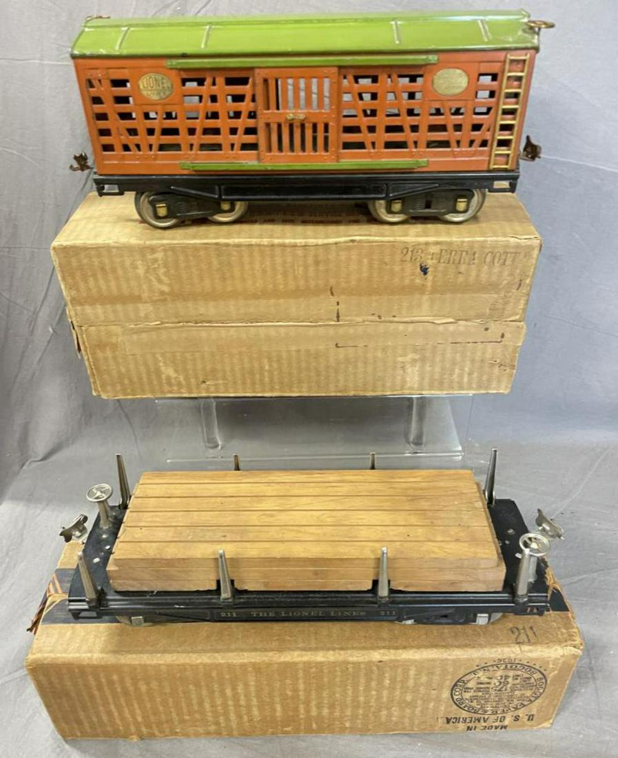 Clean Boxed Lionel 213 & 211 Freight Cars: Standard gauge. Includes a 213 Stock car; 211 Lumber car with original load. They are clean & shiny, showing light play wear with boxes.