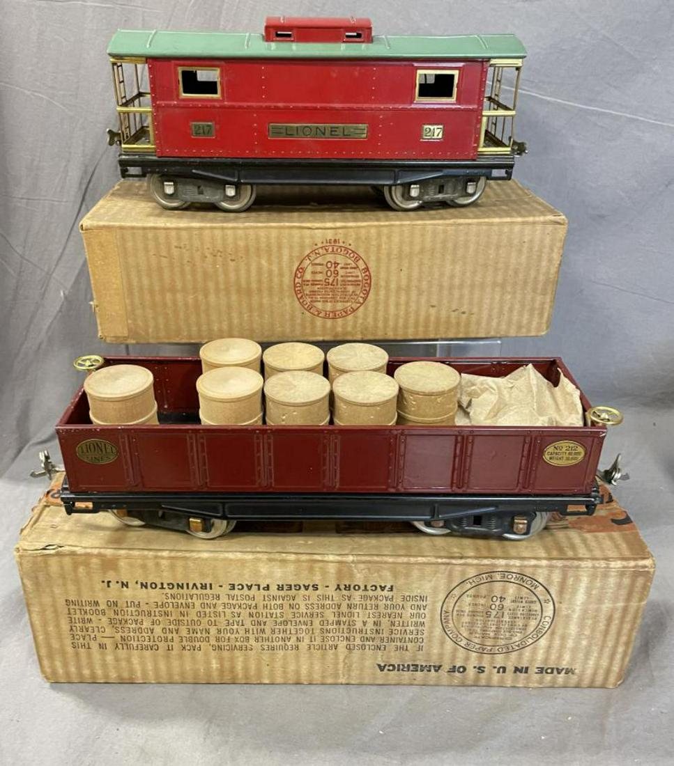 Nice Boxed Lionel 212 & 217 Freight Cars: Standard gauge. Includes a 212 Wine gondola with 8 Split Drums; 217 Caboose, mid period colors. Both show light use with boxes.