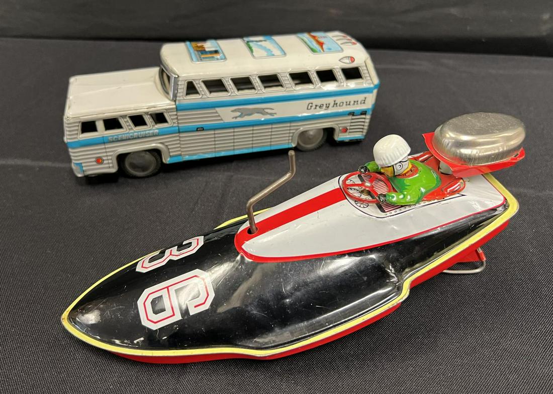 2 Japanese Tin Lithographed Vehicles: Includes an SN Japan Greyhound Bus, approx. 9" long; SAN, Japan Racing Boat, crank action not working. They both show light playwear.