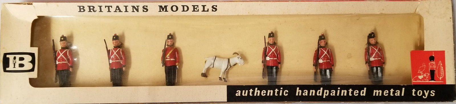 Britains #9158 Canada Fort Henry Guards: 7 piece set, still tied in original cello window box. Box is a little rough, cello is pushed in and loose, box has some tears and wear.
