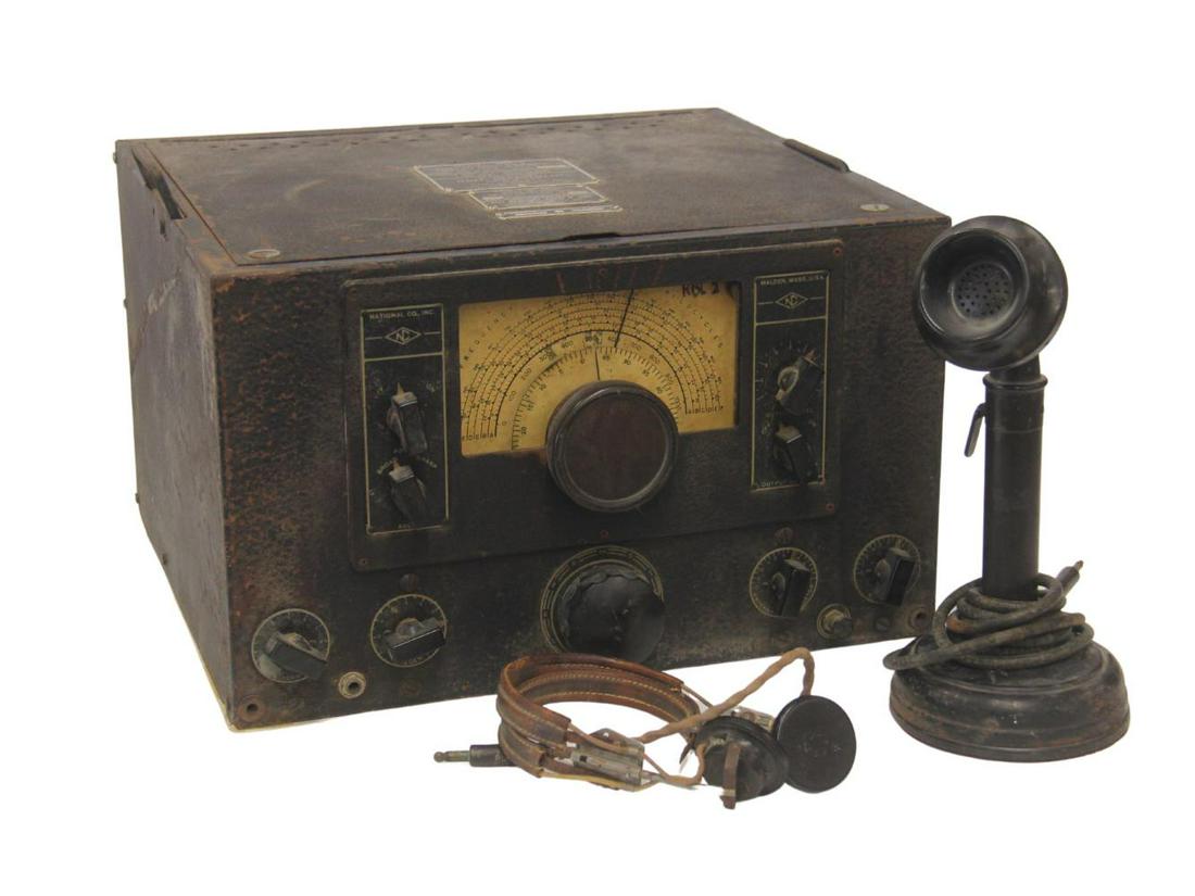 WWII U.S. Navy Radio Receiver: WWI U.S. Navy radio receiver with headset and mouthpiece. Measures approximately 15 1/4 by 17 1/4 by 10 5/8 inches. Item is oversized and very heavy; please contact prior to bidding for a shipping quo