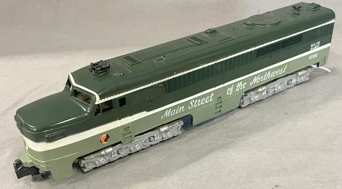 Nice American Flyer 21551 NP PA Alco Diesel: S Gauge. Clean & shiny with one side sticker showing some wear. This is the later version with molded steps with 2-position reverse. It otherwise shows light play wear.