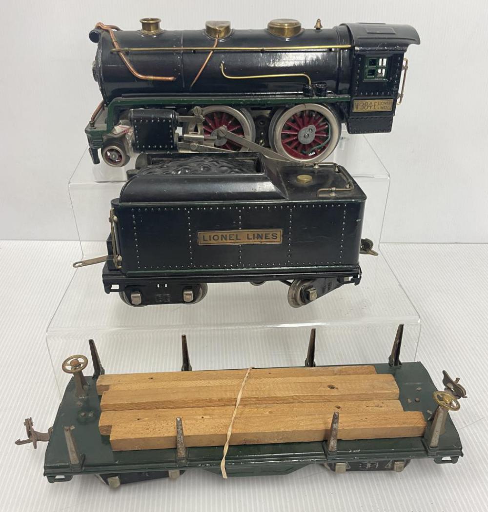 Lionel 384, 384T & 511: Standrad Gauge. Includes a 384 Steam loco, boiler repainted poorly, 1 linkage screw broken; 384T tender; 511 late lumber with a few boards. Rest show moderate play wear.