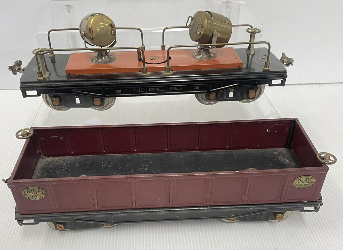 Lionel 220 & 212 Freight Cars: Standard Gauge. Includes a 220 searchlight and 212 Gondola. They would benefit from a cleaning and shows light play wear.