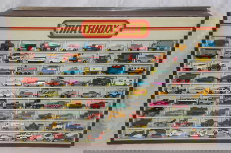 Matchbox Display Case with 81 Vehicles: Vintage 1980's Matchbox display case with 81 Matchbox vehicles. Cars present may not be in the correct order. Case measures approx. 32 1/4 by 21 1/2 by 9 1/4 inches. Back of case features sliding door