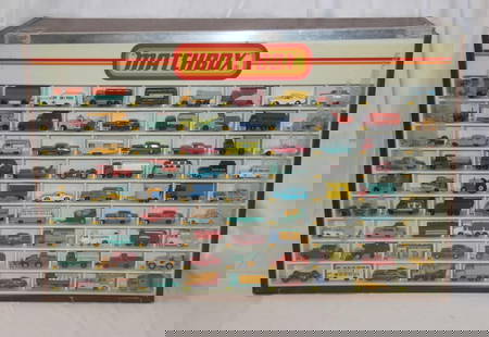 Matchbox Display Case with 81 Vehicles: Vintage 1980's Matchbox display case with 81 Matchbox vehicles. Cars present may not be in the correct order. Case measures approx. 32 1/4 by 21 1/2 by 9 1/4 inches. Back of case features sliding door