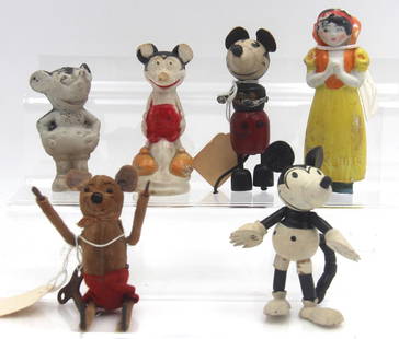 Disney Related Character Figurine Lot: Includes bisque Snow White, Schuco wind up Mickey Mouse, bisque Mickey Mouse, and others. All show overall wear with paint loss, scuffs, scratches. Some pieces have damage.