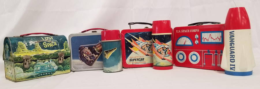 (4) Tin Litho Lunch Boxes and Thermoses: 4 tin litho lunch boxes, 3 with thermoses, including Lost in Space (without thermos), Mike Mercury's Supercar, U.S. Space Corp. and Space Capsule. Some wear and paint loss.