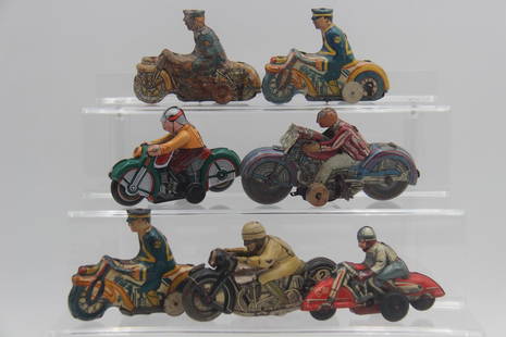 (7) Tin Litho Motorcycles: 7 tin litho motorcycles. Some paint loss. Includes Marx, Schuco, HKN, and others. Range from approx. 4 1/2 inches to 5 3/4 inches.