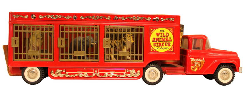 Boxed Buddy L Wild Animal Circus: Boxed Buddy L pressed steel Wild Animal Circus. Complete with animals. Box has end flaps missing on one side and some general wear.