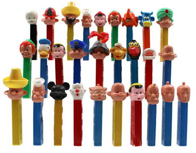 Pez Lot. "Attic Find": Lot includes 15 Vintage Pez Dispensers plus a load of Parts and Partial Pez dispensers, See images for details.