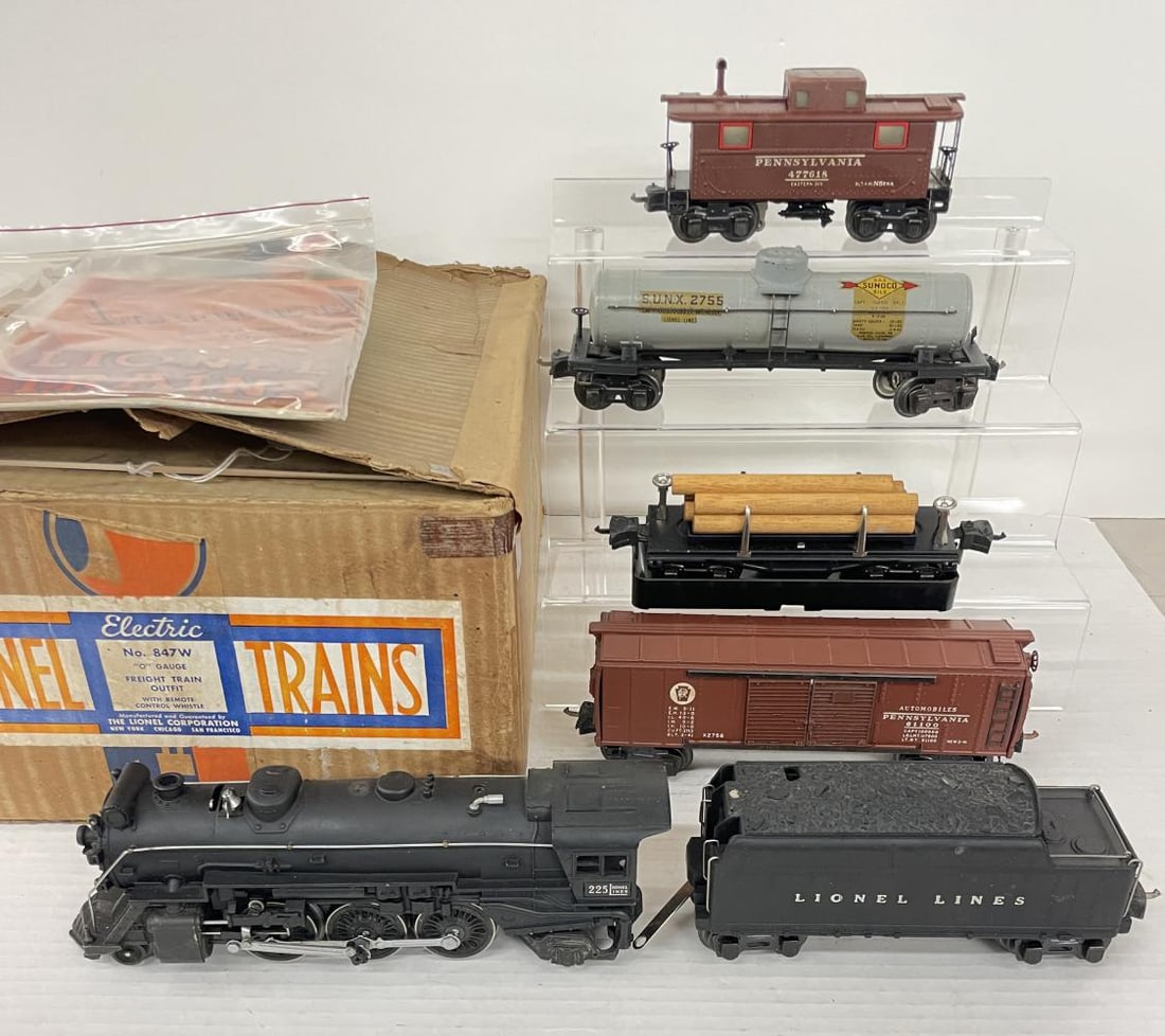 Boxed 1941 Lionel 225 Set 847W: Includes a 225 Steam loco; 2235W Bakelite whistling tender, wrapping with packing rings; 2458 PRR Boxcar, ends lightly warped; 3461 Log dump car with bin, wrap and packing rings; 2755 Sunoco Tank, 92