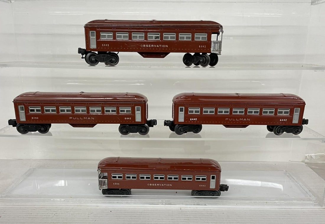 4 Lionel 6440 Passenger Cars: Includes 2-6440 Pullmans; 2-6441 Observations, 3 have magnetic couplers, all are clean and shiny, showing moderate play wear.