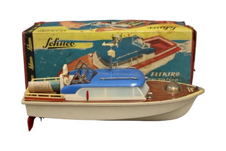 Schuco Elektro Nautica 5550 Boat in Original Box: Battery operated boat in original box. Approx. 14" long x 4-3/4" wide. Untested. Light corrosion to windshield frame. Includes composition figure and radar. Front end of boat has some paint loss and l