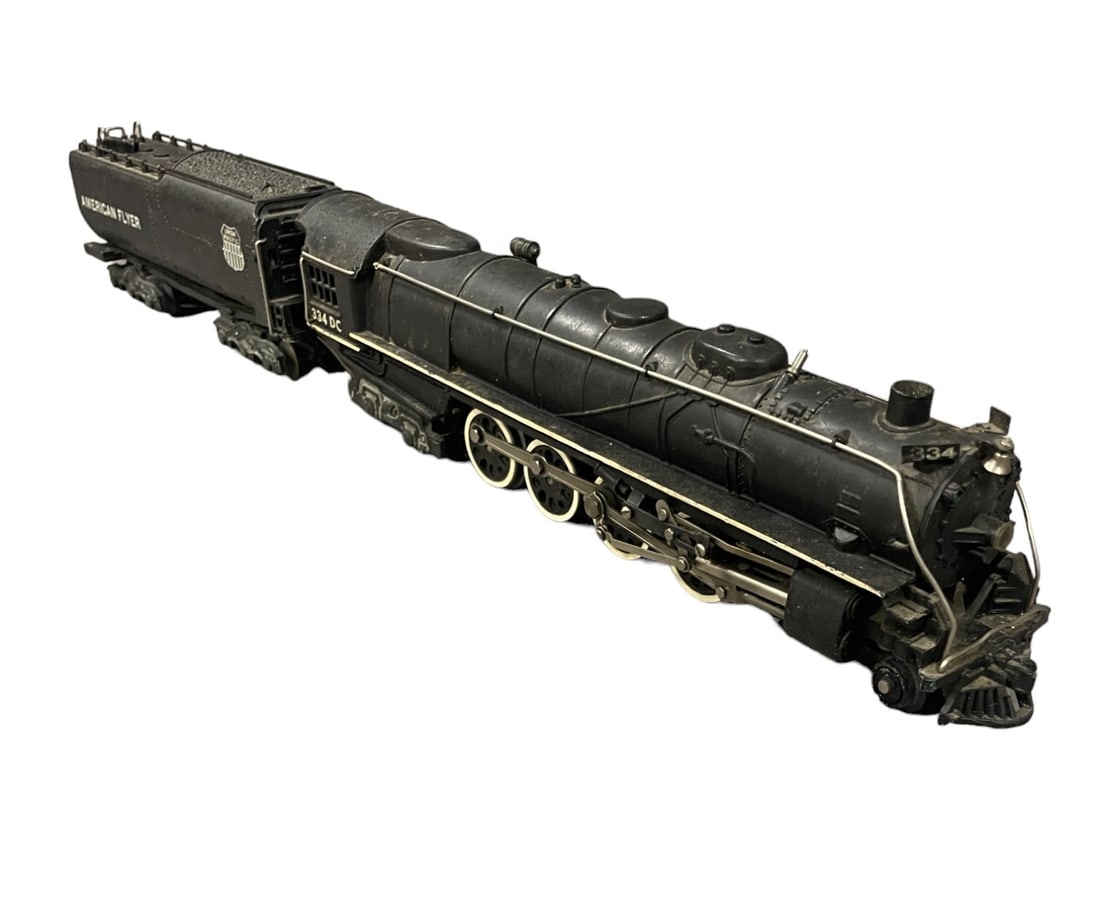 American Flyer 334DC UP Northern: S Gauge. 98% stripe with both number boards intact. UP Vanderbilt oil tender, 1 front sep off, but piece is included(was glued). It would benefit from a cleaning and show light play wear.