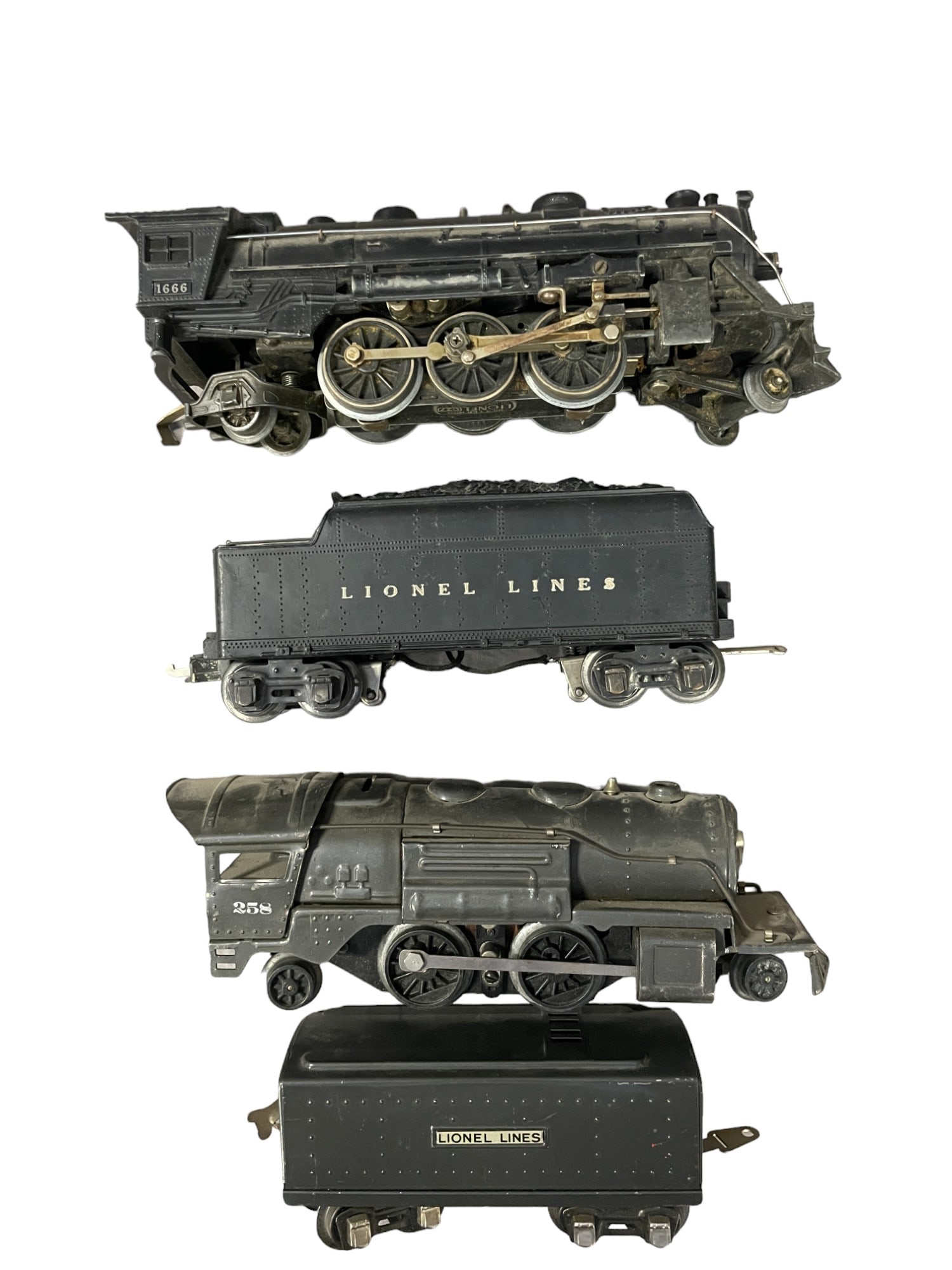 Lionel 1666 & 258 Steam Locos: Includes a 1939 -258 loco with matching 1689T tender, scarce in gunmetal; 1941- 1666 with 2666W whistling tender, LBC. They would benefit from a cleaning and show light play wear.