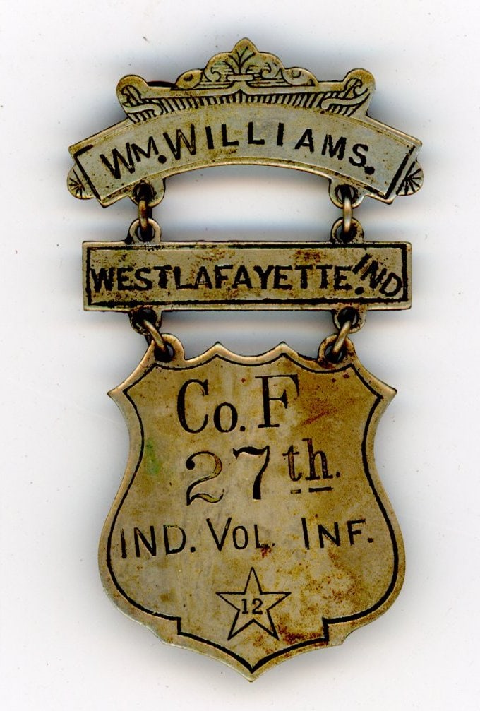 Civil War Identification Badge Ind. Vol. Inf.: Civil War Identification Badge for William Williams, a private in Company F of the 27th Indiana Volunteer Infantry. Possibly made during the Civil War, or possibly a post-war veteran's badge. Marked o