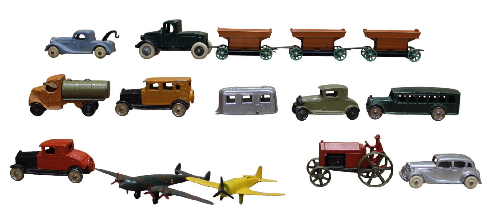 Tootsie Toy Vehicle Collection: 12 Tootsie toy cars, trucks, and planes. Mostly very minor paint loss.