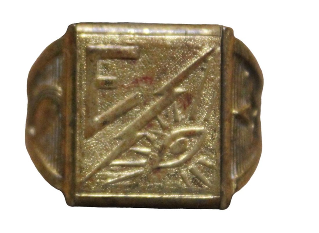 Superman Secret Chamber Ring w/Initial "E": One of 2 designs from 1941, produced by Ostby & Barton of Rhode Island and used by dairies participating in the Superman Defense Club Milk Program. Gold coiled brass finish ring, top features various 