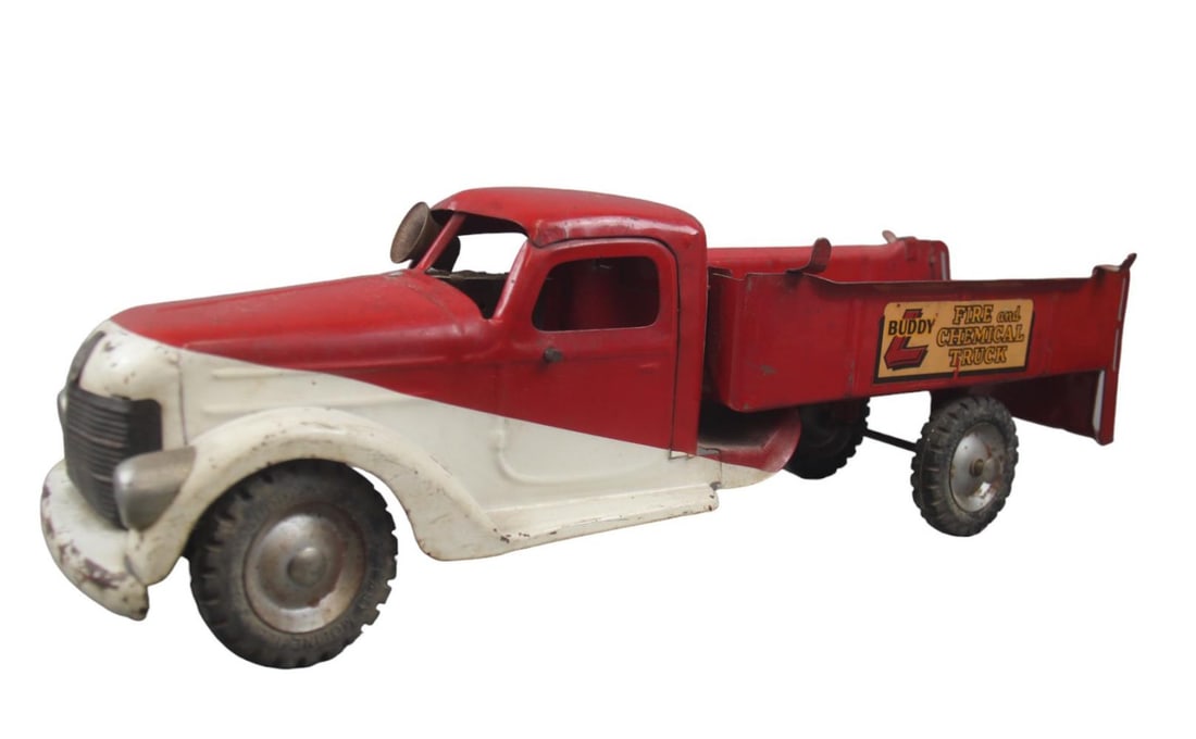 1940s Buddy L Chemical Fire Truck: Painted pressed steel with rubber tires, 23 inches long. It has nice decals and has a functional siren, but worn. It is missing the ladders and canister and shows moderate play wear & would benefit fr