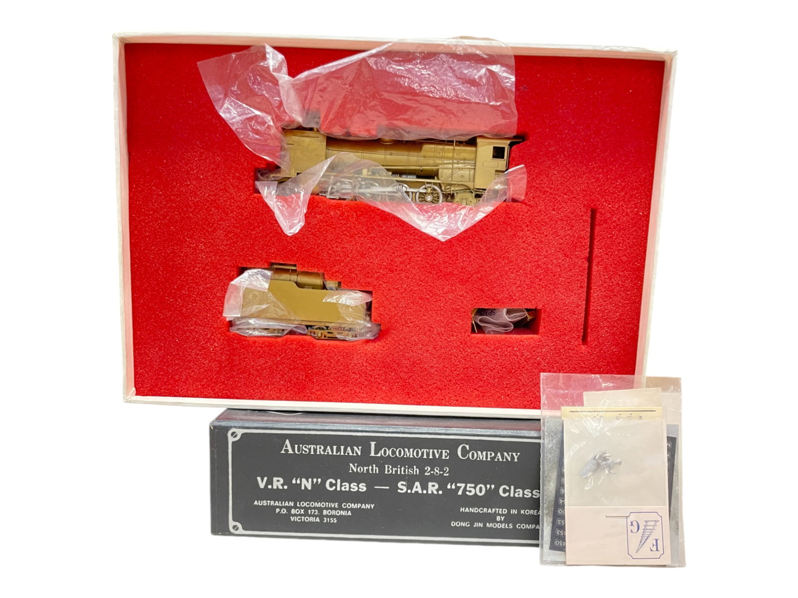ALC HO Brass North British 2-8-2: Nice gold tone finish, well detailed loco & tender. It appears new in box with extras and nice box.