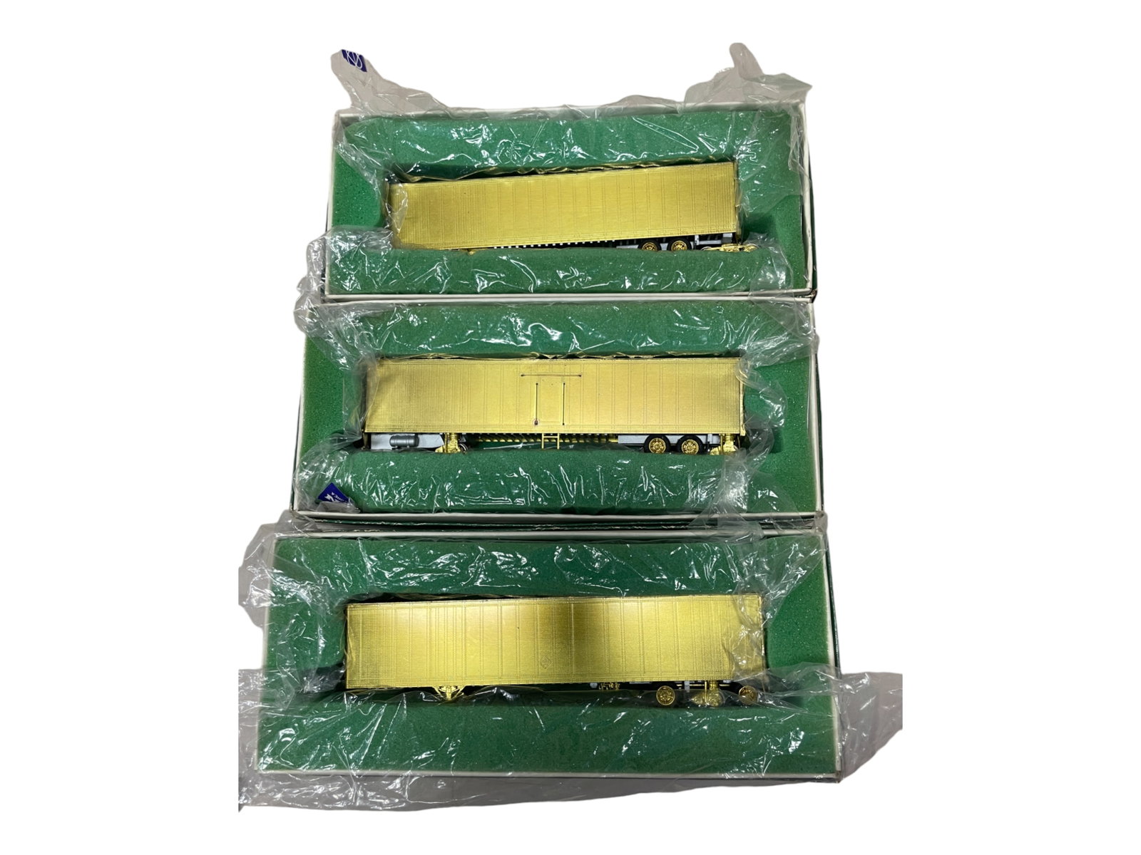 3 Overland HO Brass Roadrailers: All unpainted. Includes a Mark V 48? Standard Trailer(NS & UP); 48? Adapter (side-door) Trailer Reefer & 48? Standard Trailer(BN, CSX & NS). They appear new in boxes.