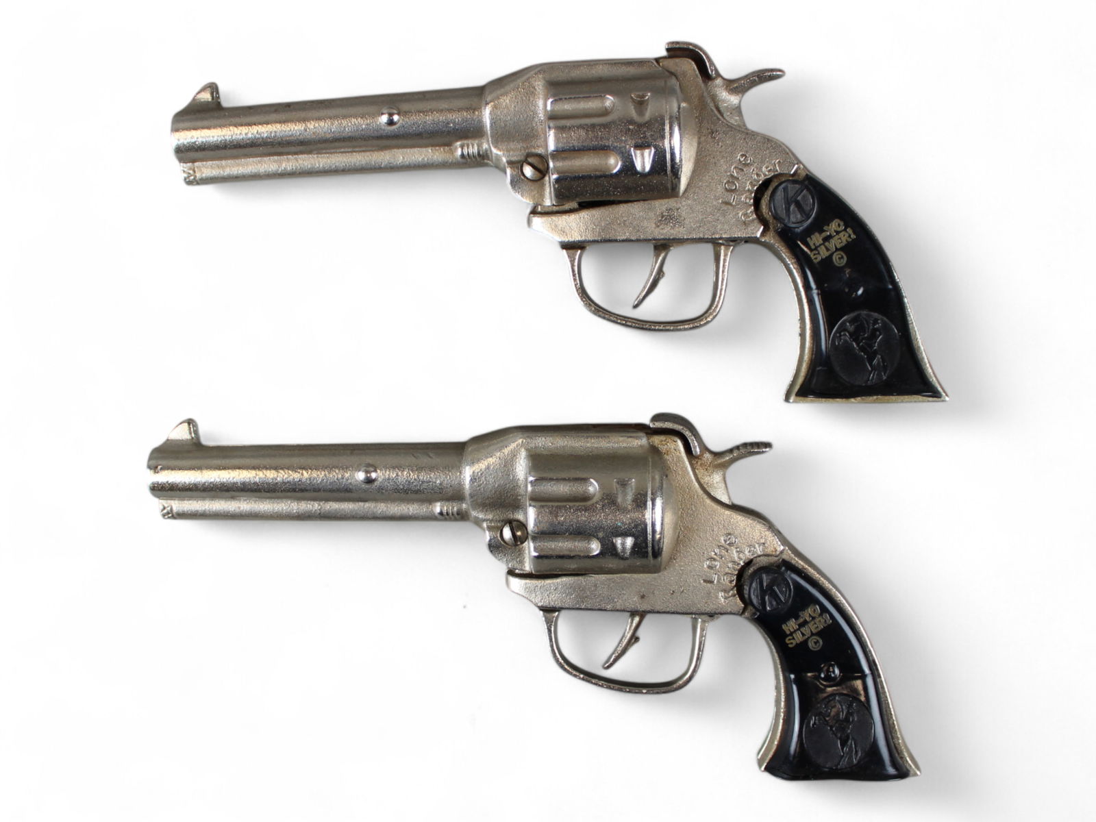 Pair of Lone Ranger Cap Guns: Kilgore Guns with black Hi Yo Silver Grips which are a bit loose.