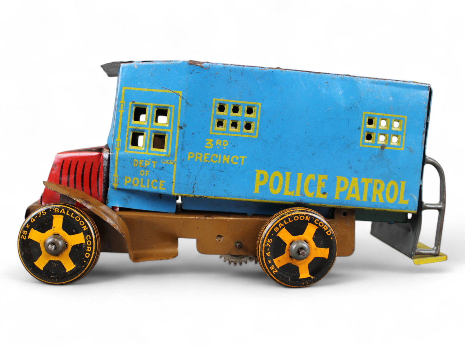 Marx Mack Police Patrol Truck: Marx tin litho Mack Police Patrol Truck. Missing front bumper. Wind up mechanism works. Approx. 10'' long.