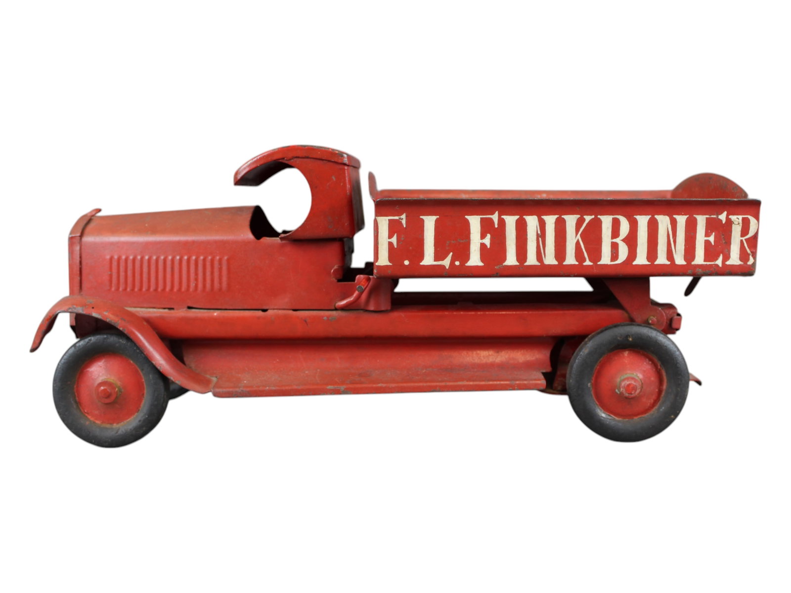 16" Pressed Steel Dump Truck: Painted on side "F.L. Finkbinder"