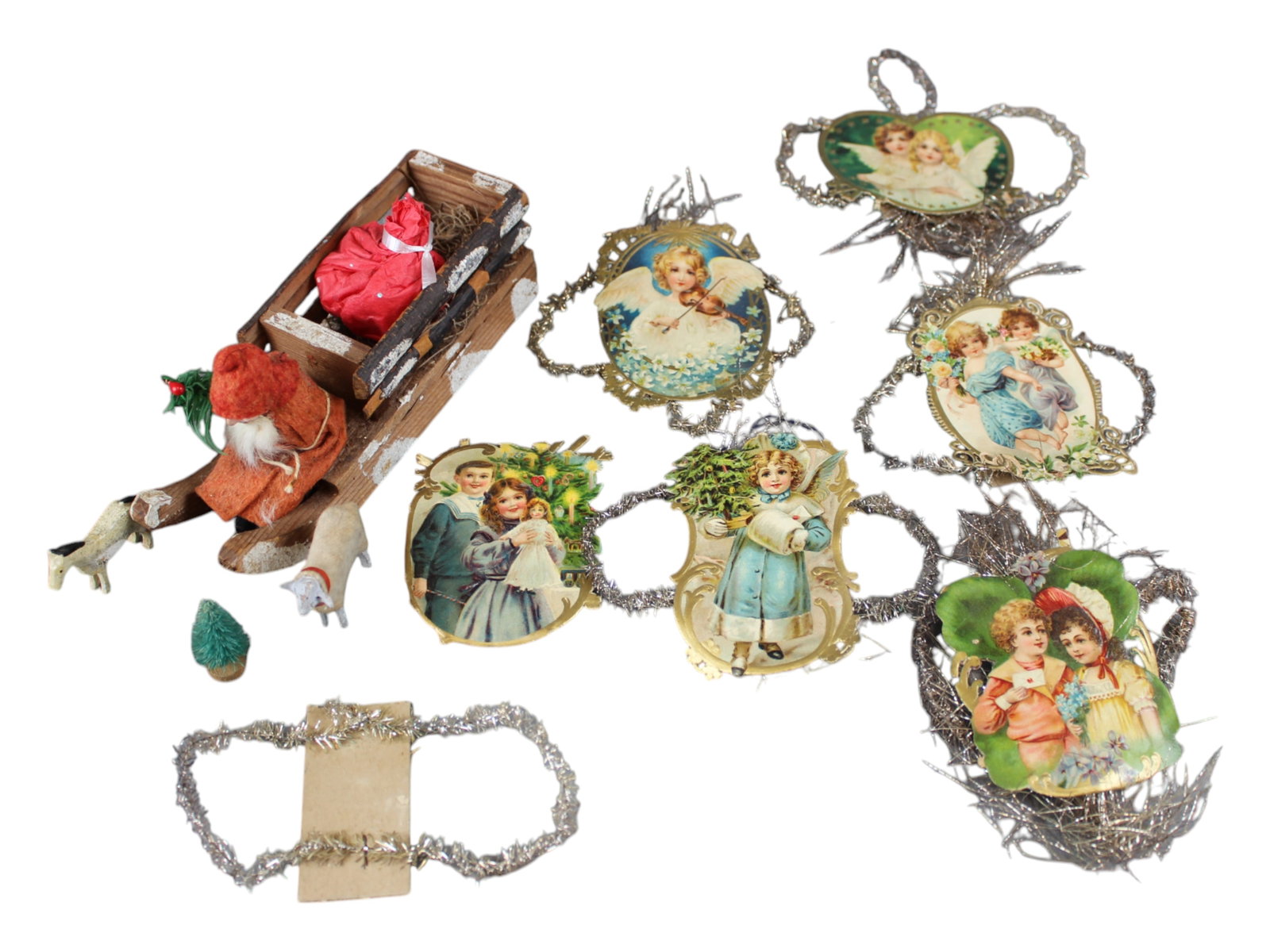 Christmas Lot: Includes 7" long Santa Claus Sleigh with Compo Santa and Cargo in Back together with (6) Chromolithographed Christmas Tree Hanging Ornaments.