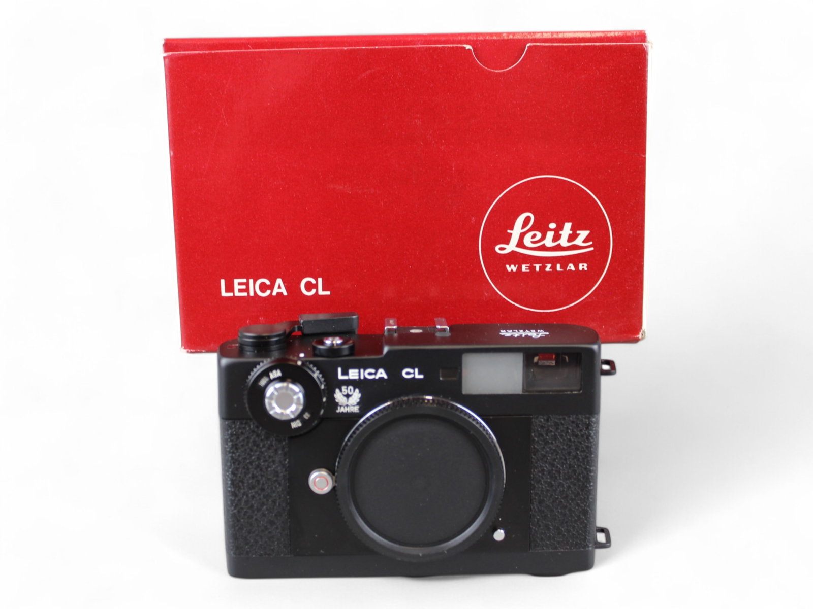 Leica CL 50 Year Black in Box: Leica CL Black 50 Jahre in box. Serial number 1429217, matching serial number on box. Includes original owner's registration card, instruction booklet, other paperwork, zipper case, and 2 straps. From