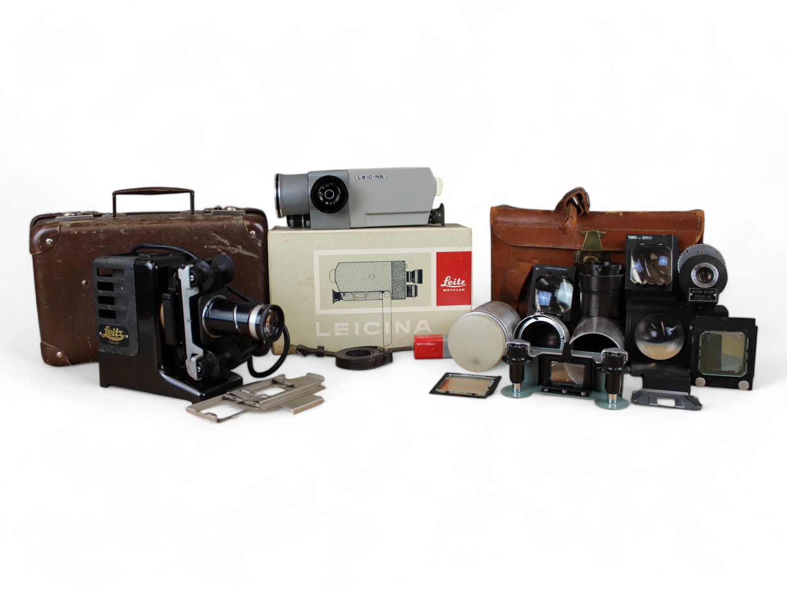 Leitz Projector, Video Camera, & Accessories: Leitz Parvo projector in carrying case with a separate leather carrying case of projector accessories and a Leitz Leicina video camera in original box.From single owner, lifetime Leica and photographi