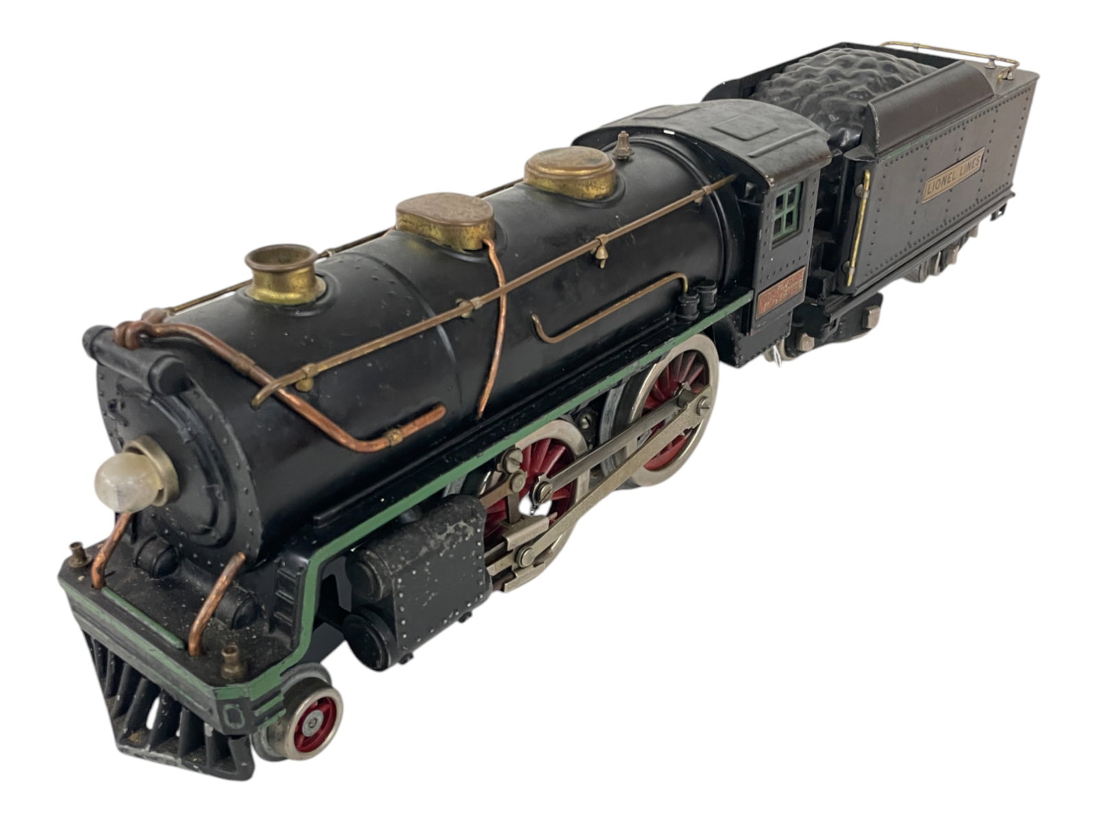 Lionel 384E Steam Loco: Standard Gauge. Good castings, rewheeled; 384T tender. It would greatly benefit from a deep clean and polish, but under the grime, shows light play wear.