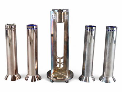 Richard Meier Swid Powell SP Candlestick Grouping: Richard Meier for Swid Powell, grouping of silverplated candlesticks, circa 1980's. Four of the candlesticks are the same with cobalt blue glass inserts. Tallest candlestick is approx. 9-1/8", others
